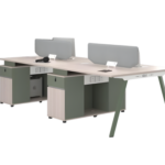Green and white four-person office workstation with desk screens and storage pedestals
